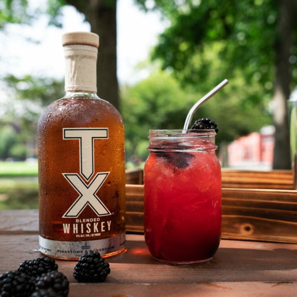 Blackberry Whiskey Sour cocktail made with TX Blended Whiskey