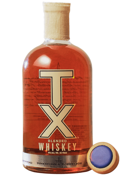 TX Whiskey bottle sitting next to a custom Ezekiel 