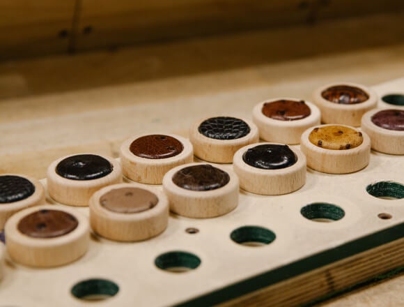 Two rows of custom caps sitting in a holder